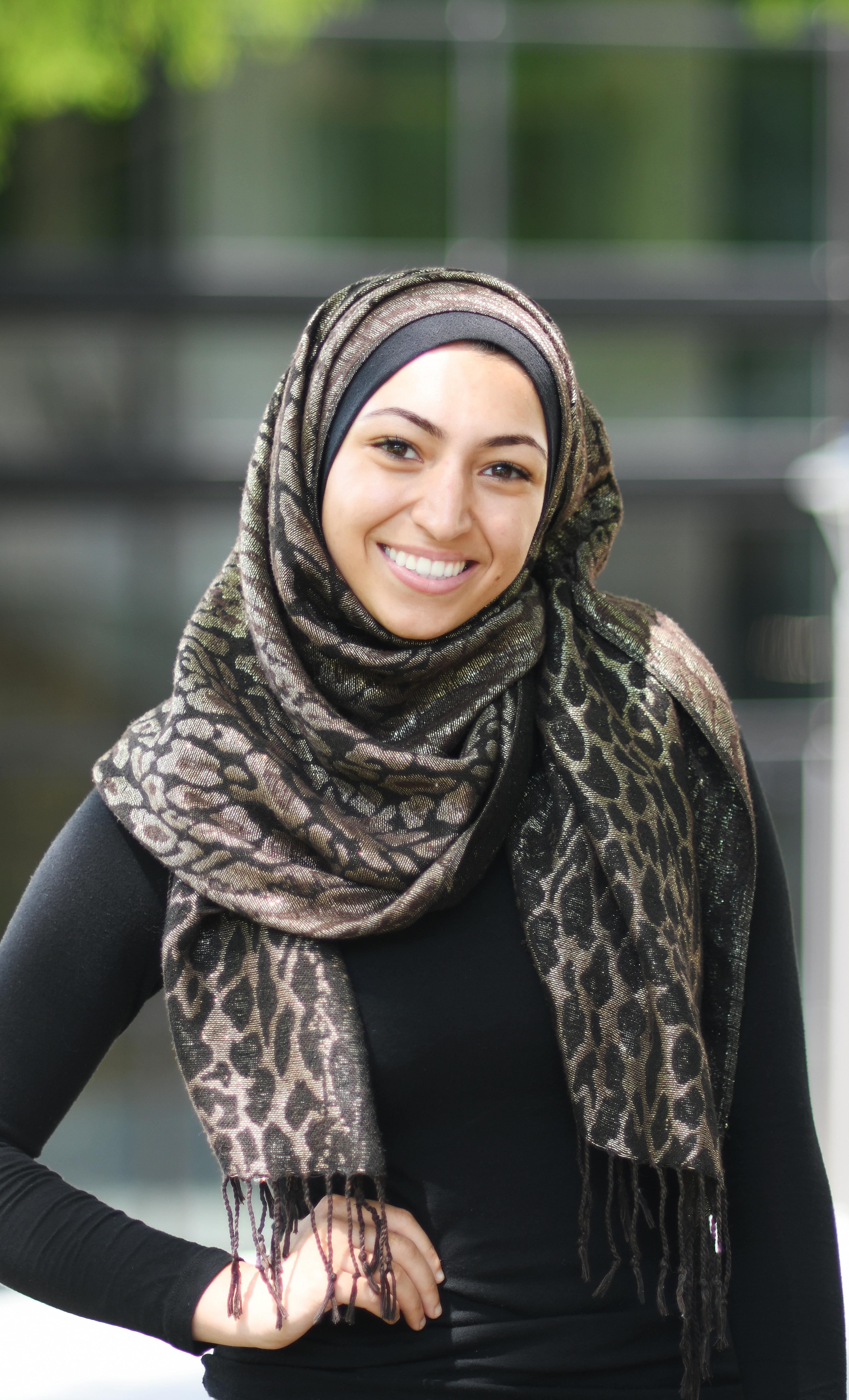 Female student, wearing hijab, smiling